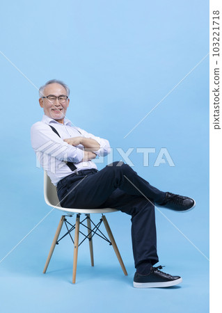 active young senior Korean Asian male sitting on the chair 103221718