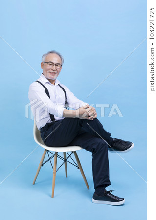 active young senior Korean Asian male sitting on the chair 103221725