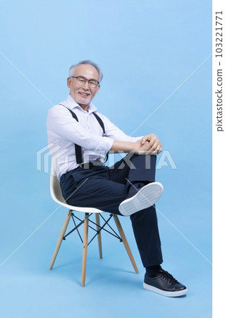 active young senior Korean Asian male sitting on the chair active young senior Korean Asian male sitting on the chair 103221771