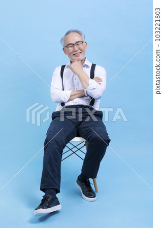 active young senior Korean Asian male sitting on the chair active young senior Korean Asian male sitting on the chair 103221803