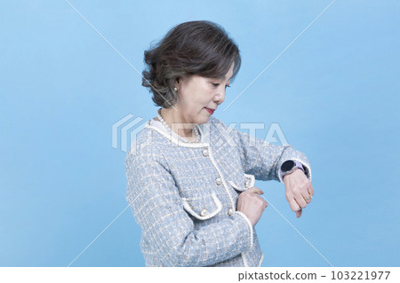 active young senior Korean Asian woman using smart watch active young senior Korean Asian woman using smart watch 103221977