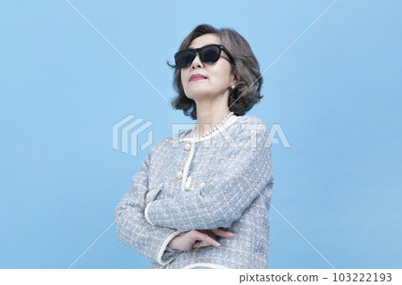 active young senior Korean Asian woman wearing sunglass active young senior Korean Asian woman wearing sunglass 103222193