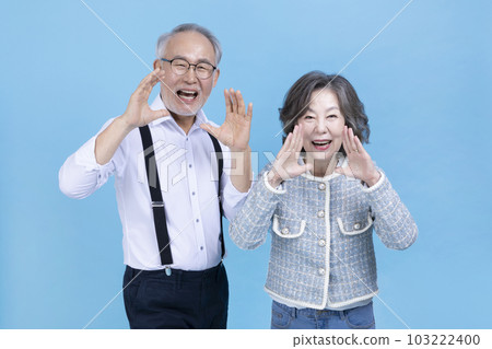 active young senior Korean Asian couple with hand motion 103222400