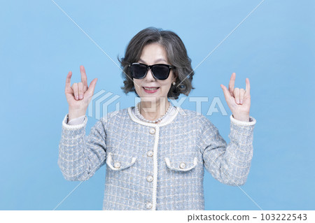 active young senior Korean Asian woman wearing sunglass 103222543