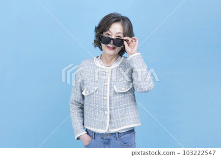 active young senior Korean Asian woman wearing sunglass active young senior Korean Asian woman wearing sunglass 103222547