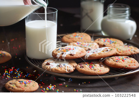 Homemade cookies with milk and colorful sprinkles on a wooden table. Generative AI Homemade cookies with milk and colorful sprinkles on a wooden table. Generative AI 103222548