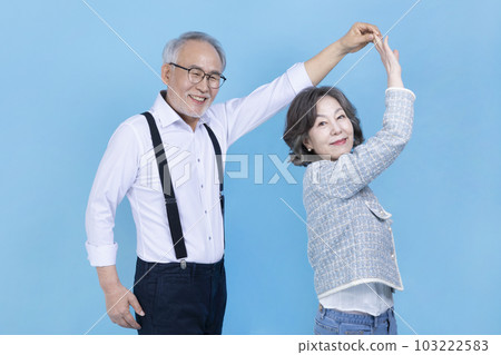 dancing active young senior Korean Asian couple, studio background 103222583