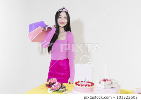 vintage y2k pink retro concept photo of korean asian cute woman in birthday party concept 103222602