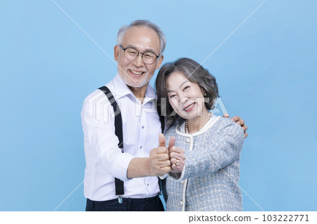 active young senior Korean Asian couple with hand motion 103222771