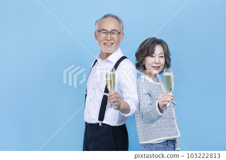 active young senior Korean Asian couple holding champagne glasses active young senior Korean Asian couple holding champagne glasses 103222813