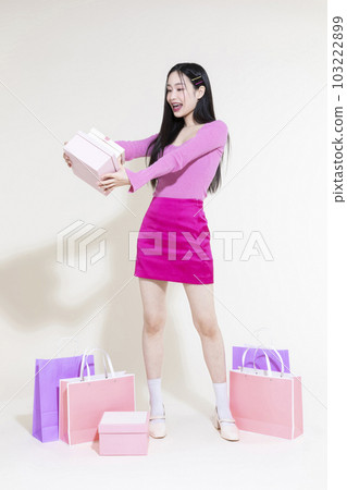 vintage y2k pink retro concept photo of korean asian cute woman holding a smartphone vintage y2k pink retro concept photo of korean asian cute woman holding a smartphone 103222899