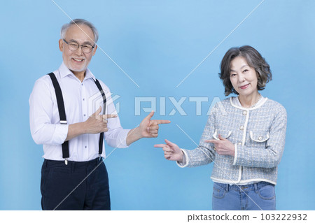 active young senior Korean Asian couple with hand motion active young senior Korean Asian couple with hand motion 103222932