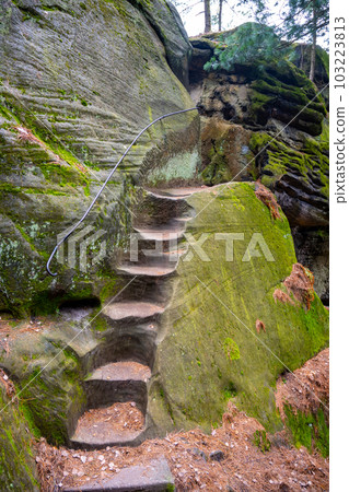 Narrow and steep staircase access to Drabovna sandstone rock castle ruin, Bohemian Paradise, Czech Republic 103223813