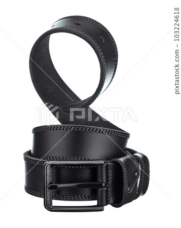 Beautiful leather belt made of black rawhide, with a metal buckle, beautifully twisted into a spiral, isolated on a white background. Beautiful leather belt made of black rawhide, with a metal buckle, beautifully twisted into a spiral, isolated on a white background. 103224618