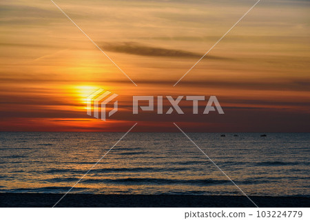 Spectacular bright golden sunset over Baltic sea Spectacular bright golden sunset over Baltic sea 103224779
