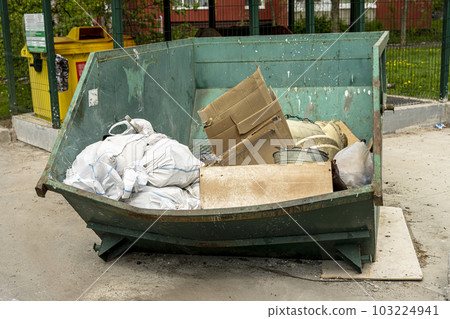 large metal container for bulky or construction debris on a garbage site 103224941
