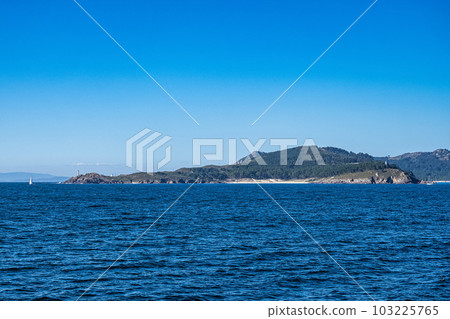 Cies Islands view and Cabo Home lighthouse in Pontevedra, Galicia, Spain 103225765