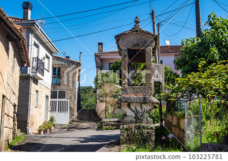 Beautiful village of Requeixo in Spain, unique for its horreos, traditional granary barns Beautiful village of Requeixo in Spain, unique for its horreos, traditional granary barns 103225781
