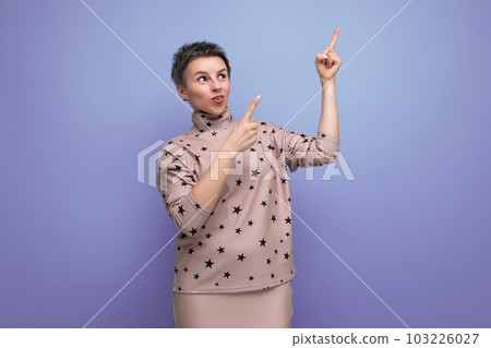 30 year old European business woman with dyed gray hair shows her hands to the sides 103226027
