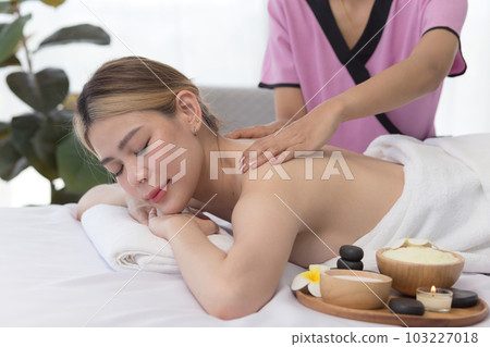 Young Asian Woman enjoying and relax massage in spa salon, Spa beauty massage healthy wellness , Lifestyle Healthy Concept. 103227018