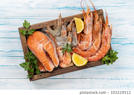Seafood in wooden box Seafood in wooden box 103229512