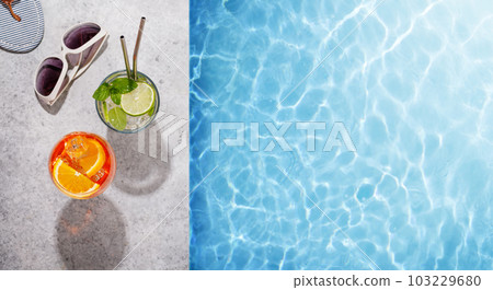 Refreshing cocktails by the pool on a sunny day Refreshing cocktails by the pool on a sunny day 103229680