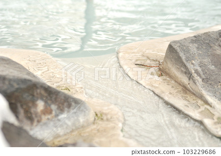 A cloudy hot spring that is poured into a bathtub A cloudy hot spring that is poured into a bathtub 103229686