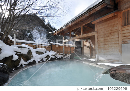 Open-air bath covered with snow, white hot spring Open-air bath covered with snow, white hot spring 103229696