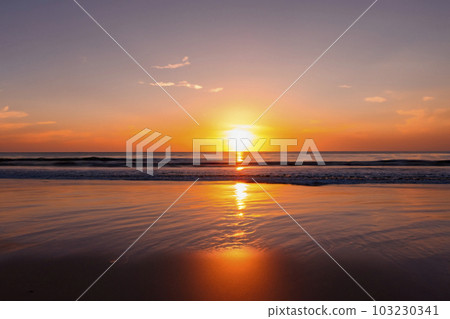 Sunset. Sunrise. Sunset on the shore of the beach with the sea calm and soft waves. Tranquility concept. Sunset. Sunrise. Sunset on the shore of the beach with the sea calm and soft waves. Tranquility concept. 103230341