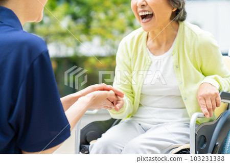 A senior woman in a wheelchair and a certified care worker "LINK FOREST" A senior woman in a wheelchair and a certified care worker "LINK FOREST" 103231388