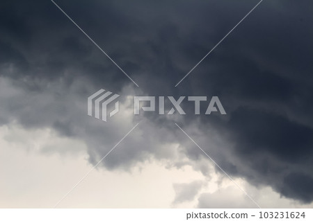 Defocus dark sky background. Dark rain clouds. Dramatic sky. Disaster weather. Copy space. Out of focus Defocus dark sky background. Dark rain clouds. Dramatic sky. Disaster weather. Copy space. Out of focus 103231624