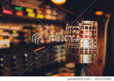 Coals for hookah close-up. Burning coals on the hookah bowl. 103232460
