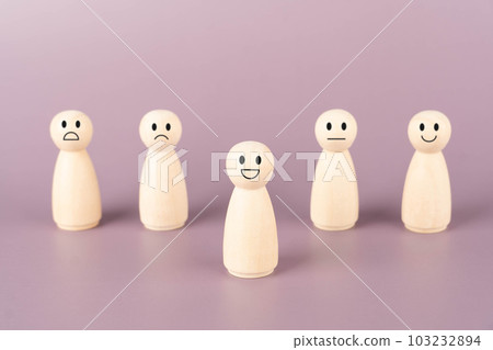 Happy smile icon on wooden doll that showing emotions and scores. Customer review, satisfaction, feedback survey, mental health assessment concept. Happy smile icon on wooden doll that showing emotions and scores. Customer review, satisfaction, feedback survey, mental health assessment concept. 103232894
