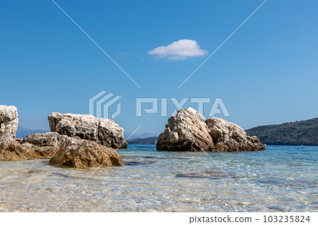 Big rocks in water on Lefkada island beach, Greece Big rocks in water on Lefkada island beach, Greece 103235824