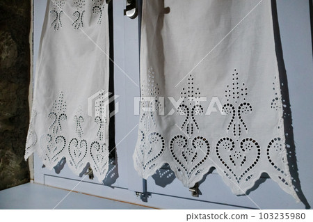 Blue window with white curtains, interior close-up 103235980