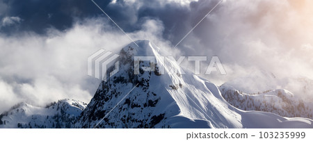 Top of Peak in Canadian Mountain Landscape covered in Clouds 103235999