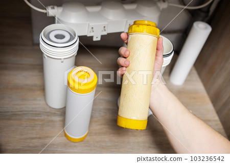 Plumber installs or change water filter. Replacement aqua filter 103236542