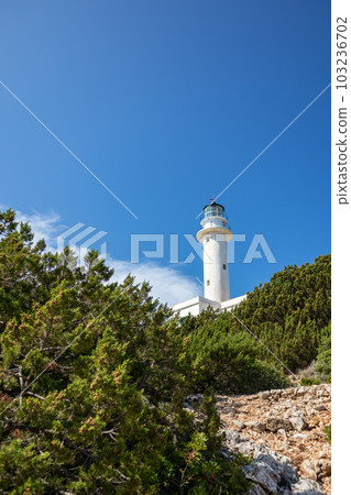 Lefkada island sea coast lighthouse on blue sky 103236702