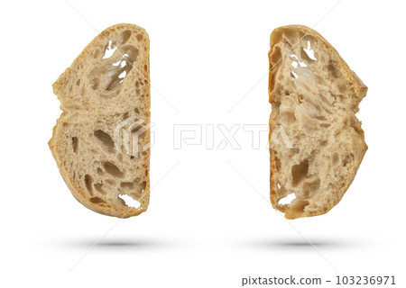Two slices of fresh Ciabatta bread on a white isolated background. Slices hang or fall on a white background. The concept of Italian bread baking or delicious breakfast. Two slices of fresh Ciabatta bread on a white isolated background. Slices hang or fall on a white background. The concept of Italian bread baking or delicious breakfast. 103236971