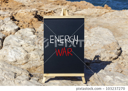 Energy war symbol. Concept words Energy war on beautiful black chalk blackboard on a beautiful stone background. Business and Energy war concept. Copy space. Energy war symbol. Concept words Energy war on beautiful black chalk blackboard on a beautiful stone background. Business and Energy war concept. Copy space. 103237270