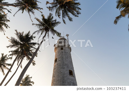 The old lighthouse of white stone located on the island The old lighthouse of white stone located on the island 103237411