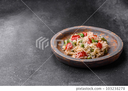 Delicious boiled rice with peppers, peas, asparagus beans and carrots 103238278