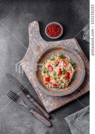 Delicious boiled rice with peppers, peas, asparagus beans and carrots 103238283