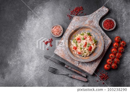 Delicious boiled rice with peppers, peas, asparagus beans and carrots Delicious boiled rice with peppers, peas, asparagus beans and carrots 103238290