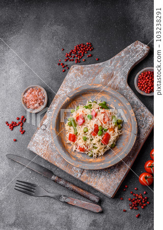 Delicious boiled rice with peppers, peas, asparagus beans and carrots Delicious boiled rice with peppers, peas, asparagus beans and carrots 103238291