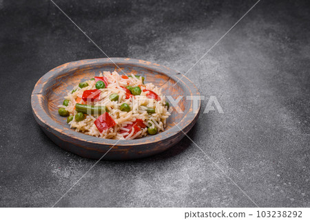 Delicious boiled rice with peppers, peas, asparagus beans and carrots Delicious boiled rice with peppers, peas, asparagus beans and carrots 103238292