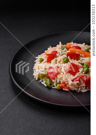 Delicious boiled rice with peppers, peas, asparagus beans and carrots Delicious boiled rice with peppers, peas, asparagus beans and carrots 103238313