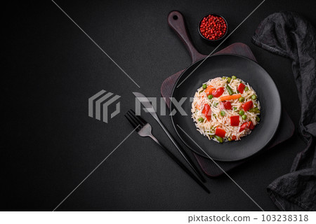 Delicious boiled rice with peppers, peas, asparagus beans and carrots Delicious boiled rice with peppers, peas, asparagus beans and carrots 103238318