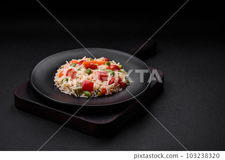Delicious boiled rice with peppers, peas, asparagus beans and carrots Delicious boiled rice with peppers, peas, asparagus beans and carrots 103238320
