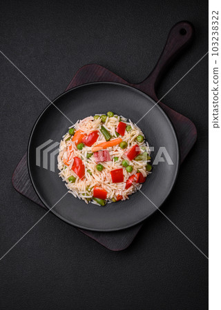 Delicious boiled rice with peppers, peas, asparagus beans and carrots Delicious boiled rice with peppers, peas, asparagus beans and carrots 103238322